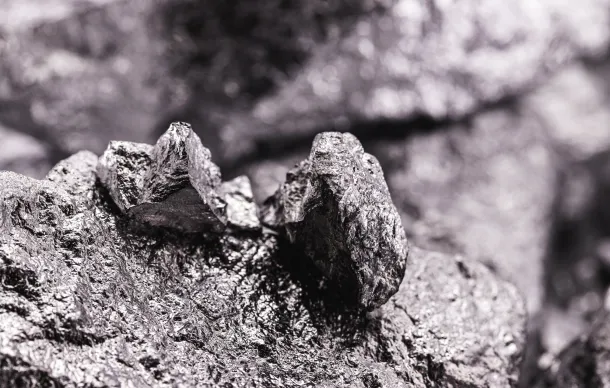 Close-up of jagged palladium nuggets with a rough silver finish.